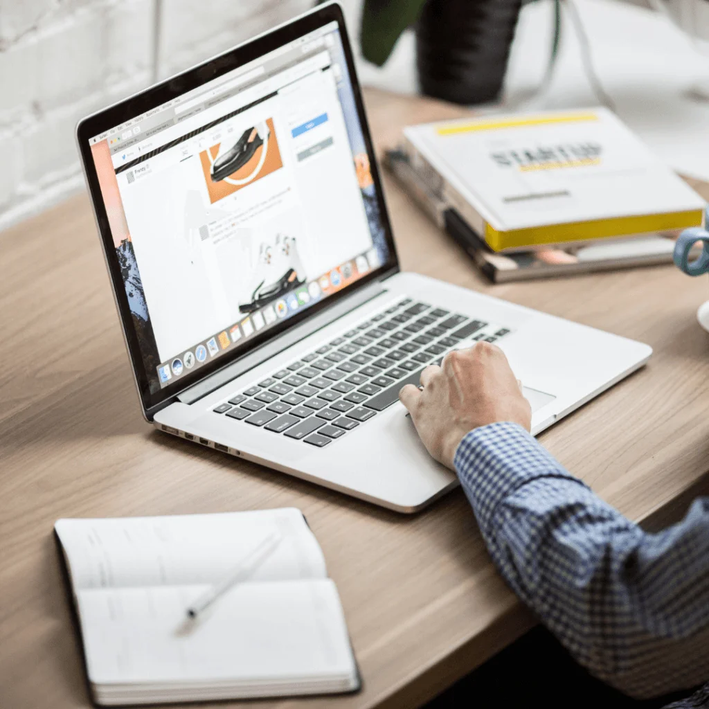 An image of someone scrolling through a website on their computer.