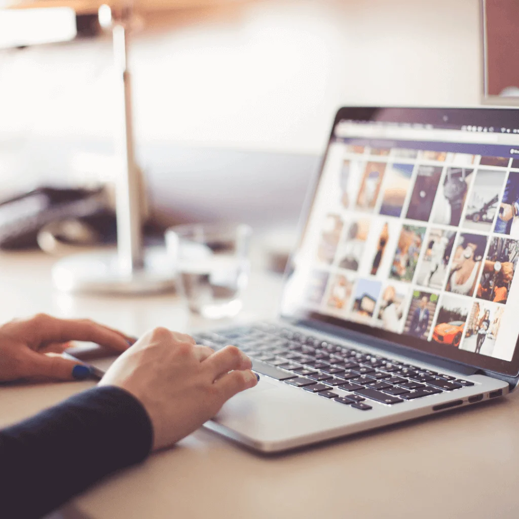 A picture of someone scrolling social media on their computer.