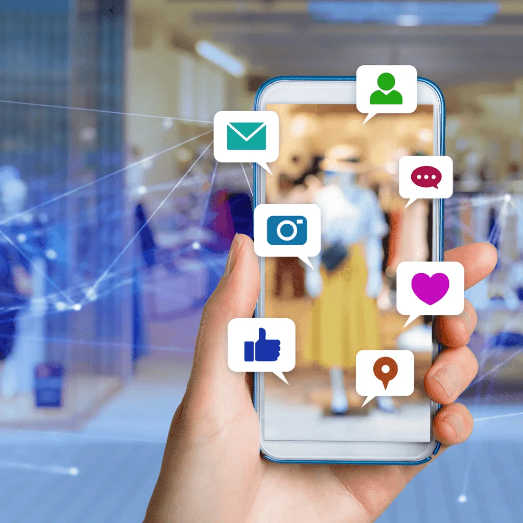 A picture of someone holding their phone while a bunch of social media type icons are on the screen.