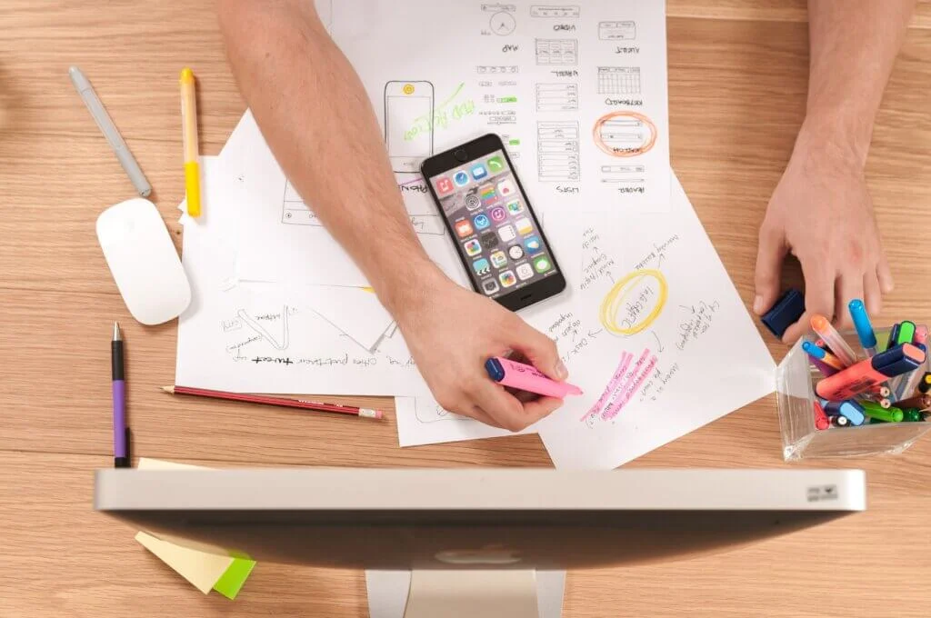 A picture of a person at a desk planning marketing strategies