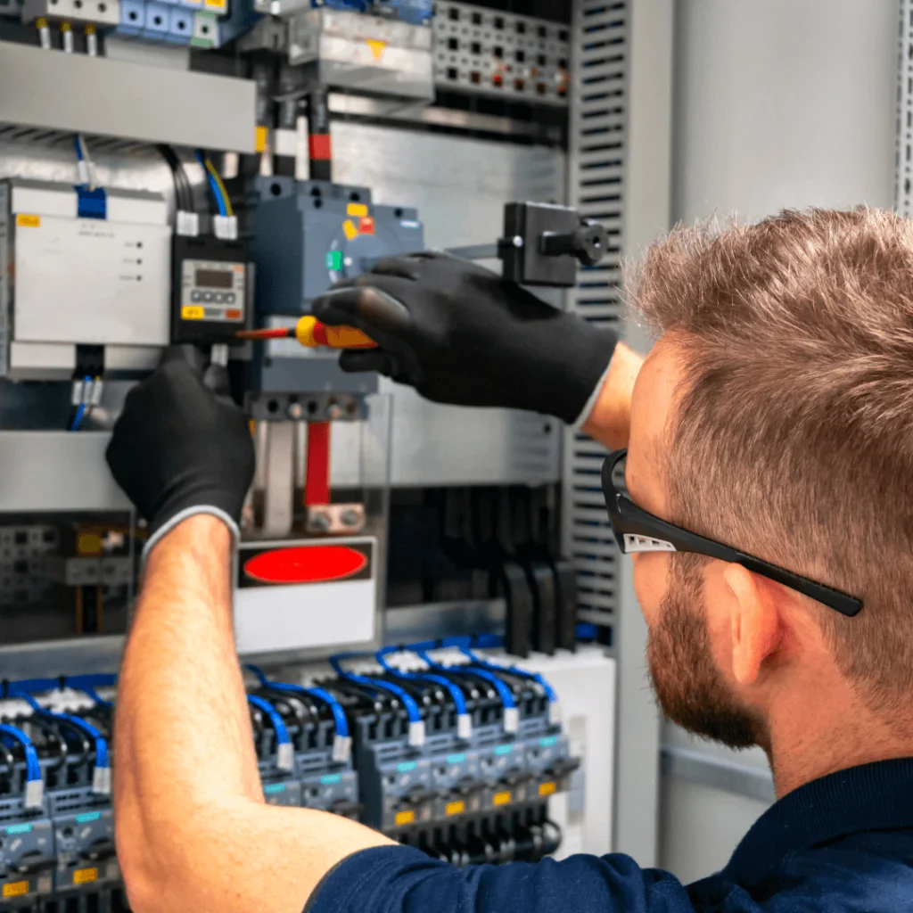 an electrician working on a grid