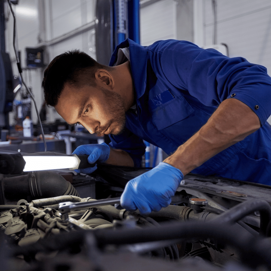 a mechanic working on a car