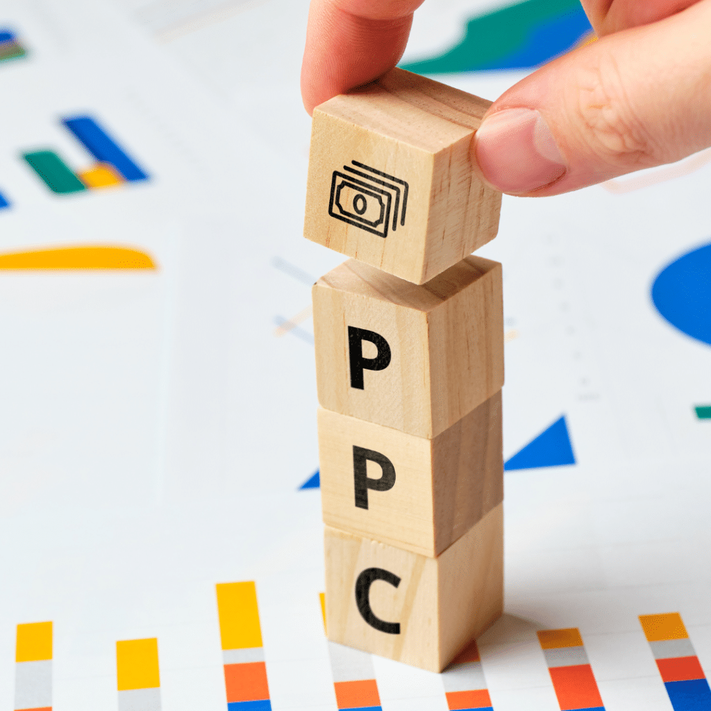 Wooden blocks stacked to spell out PPC.