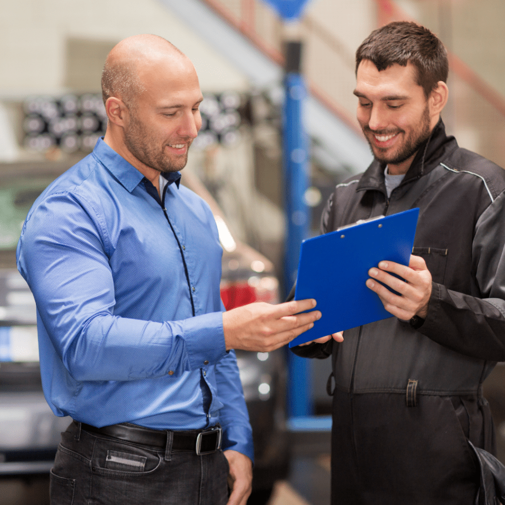 A smiling small business owner is looking at a clipboard. 