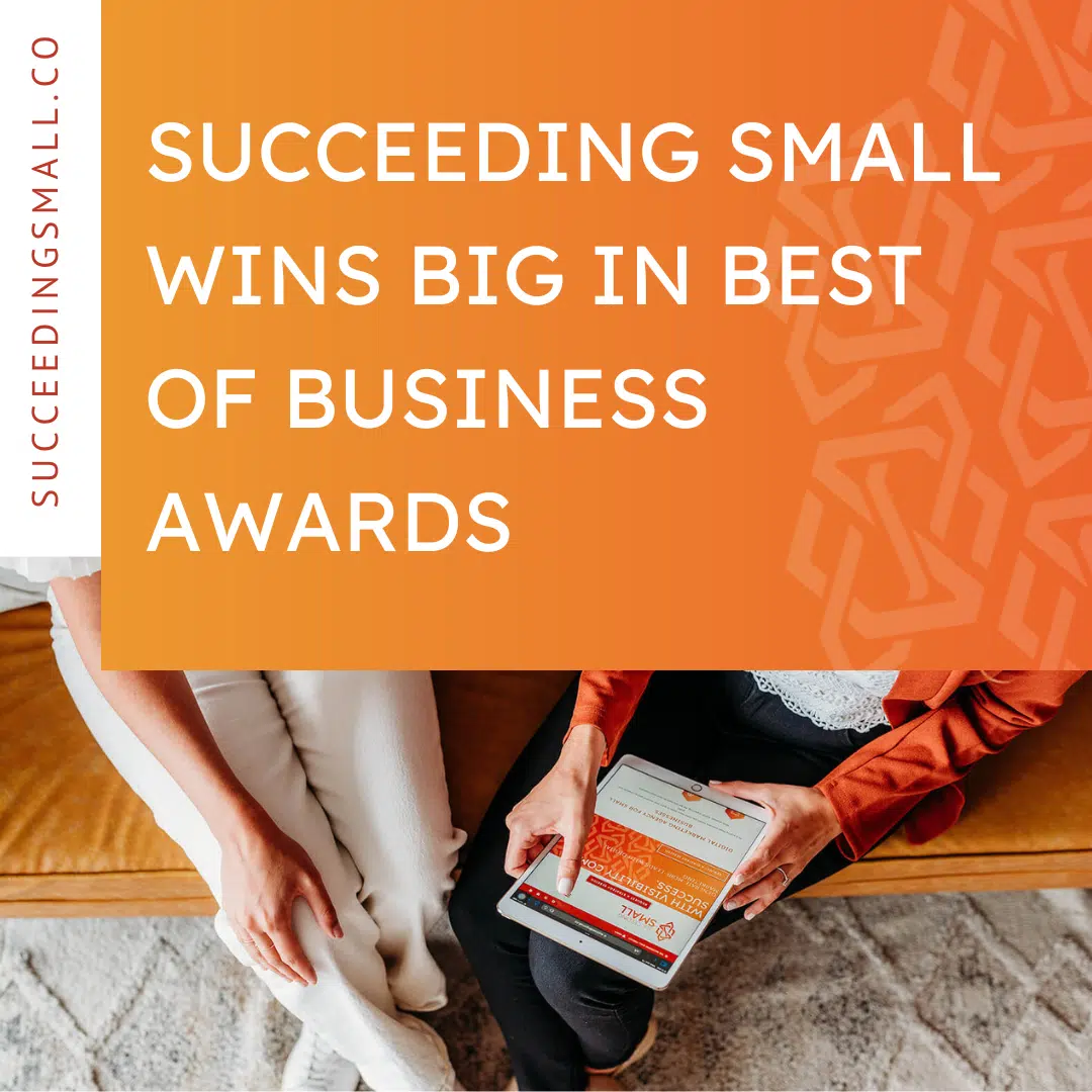 A picture of two business owners scrolling Succeeding Small's website with a blog title overlay that reads: Succeeding Small Wins Big in Best of Business Awards"